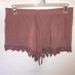 Deep pink shorts with flower pattern